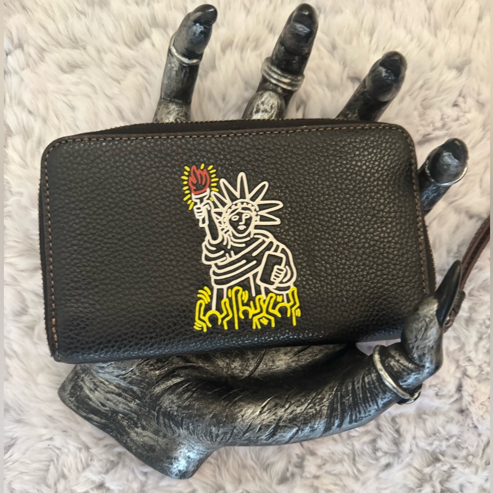 Coach x Keith Haring zip wristlet. Never worn. Amazing condition!